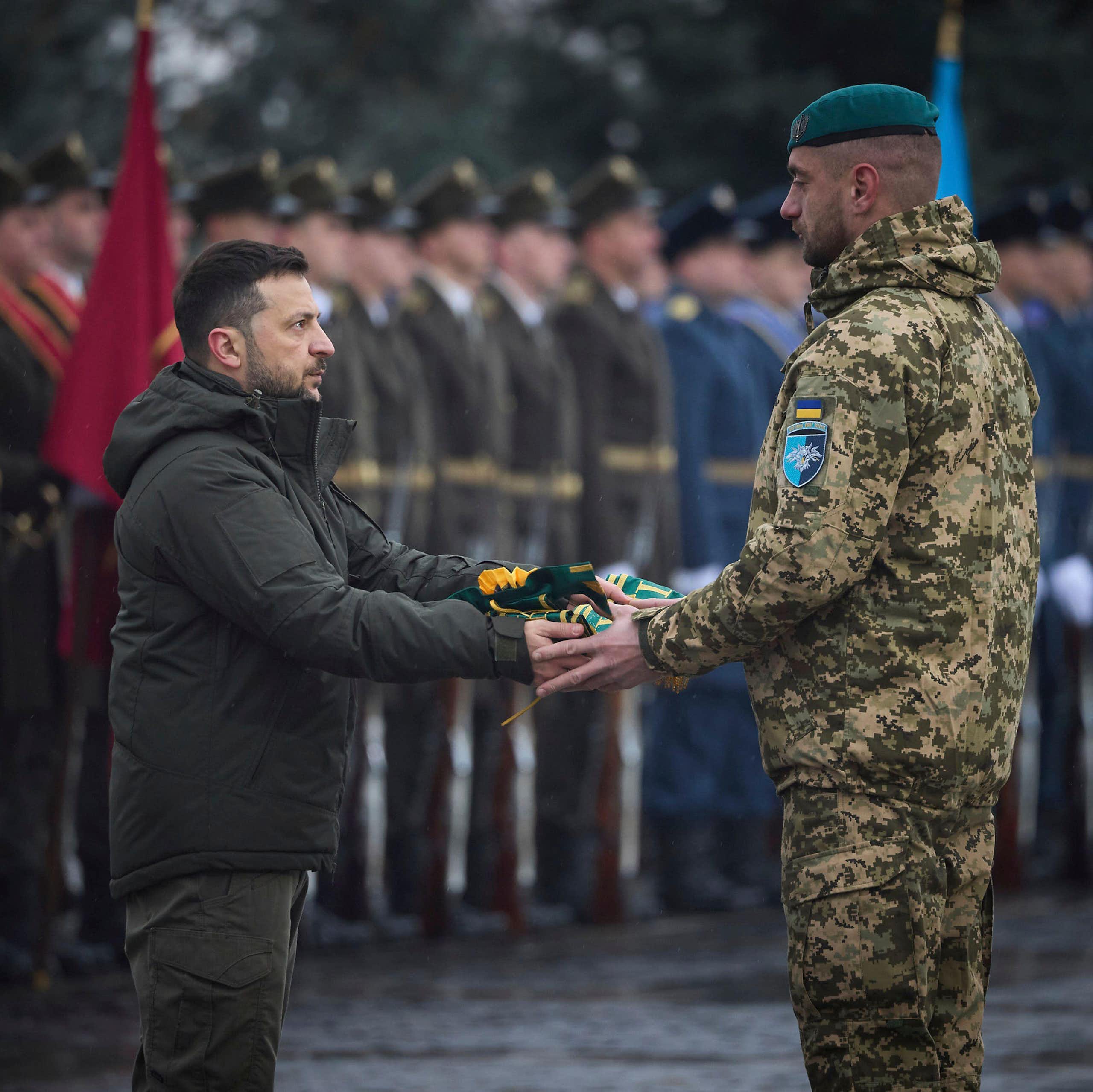 Volodymyr Zelensky hands a medal to a Ukrainian soldier during a ceremony in Kyiv, December 2024.