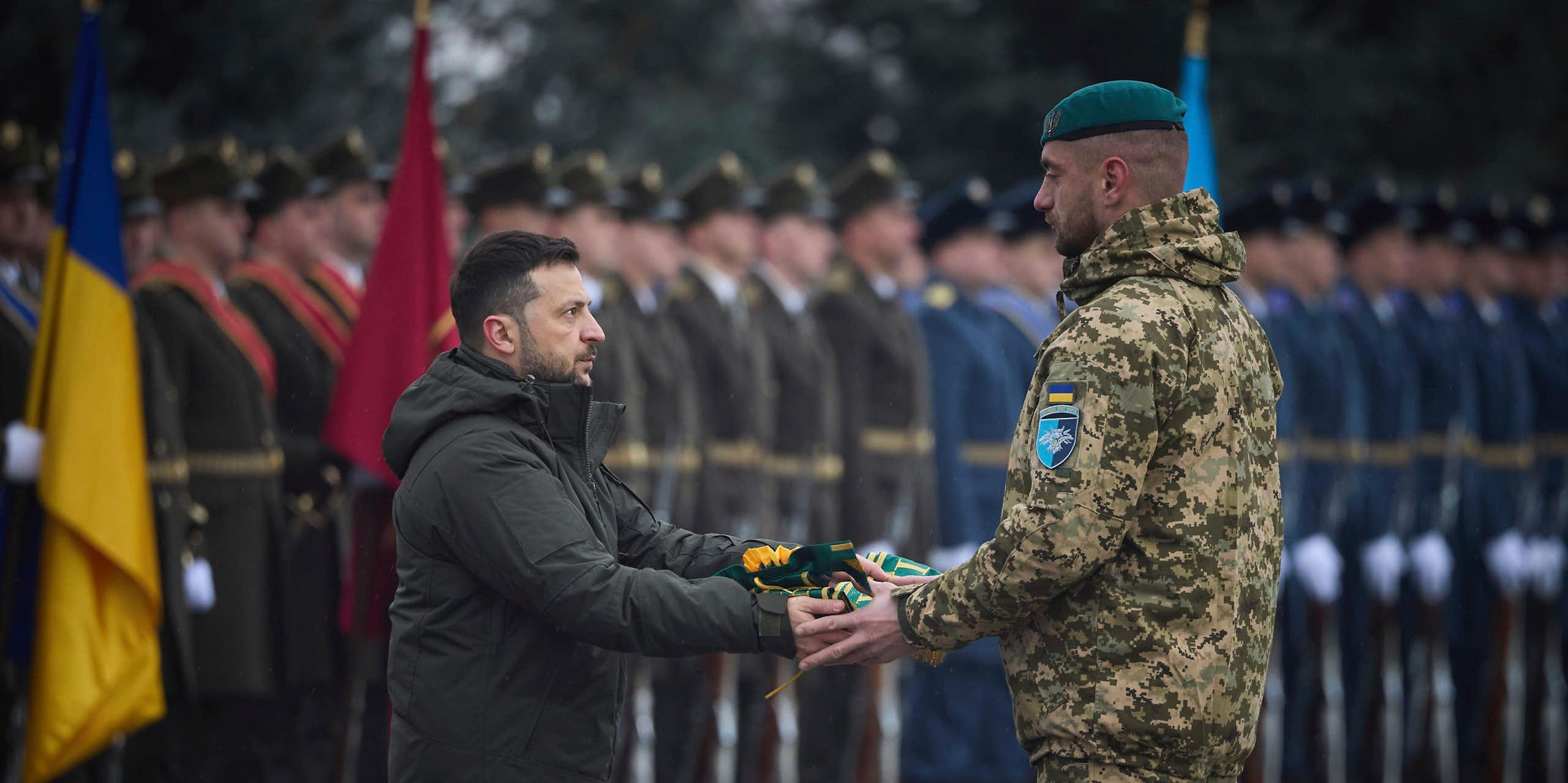 Volodymyr Zelensky hands a medal to a Ukrainian soldier during a ceremony in Kyiv, December 2024.