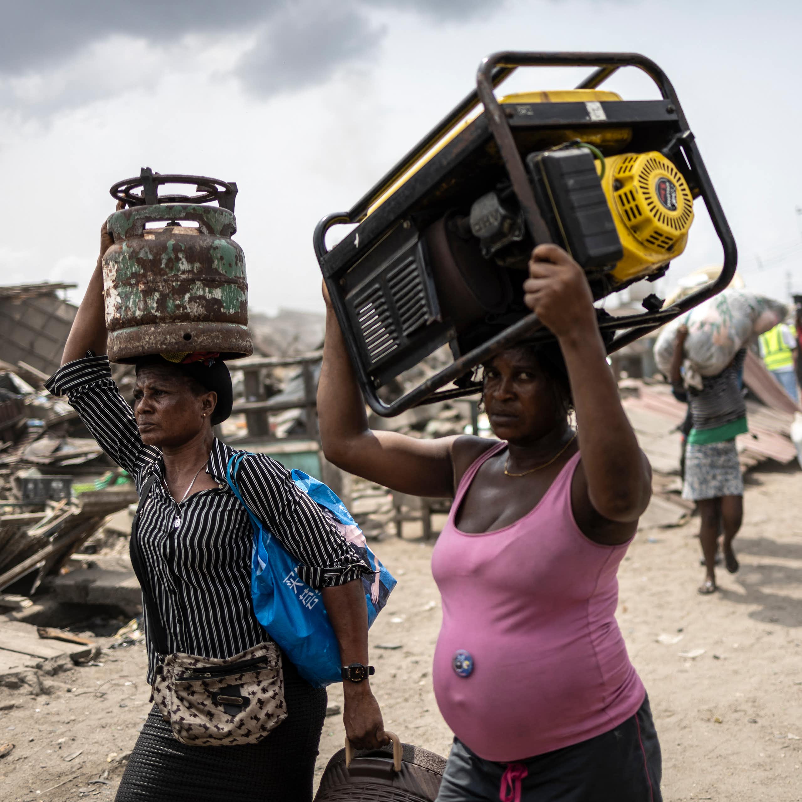 Women carrying household items on their head