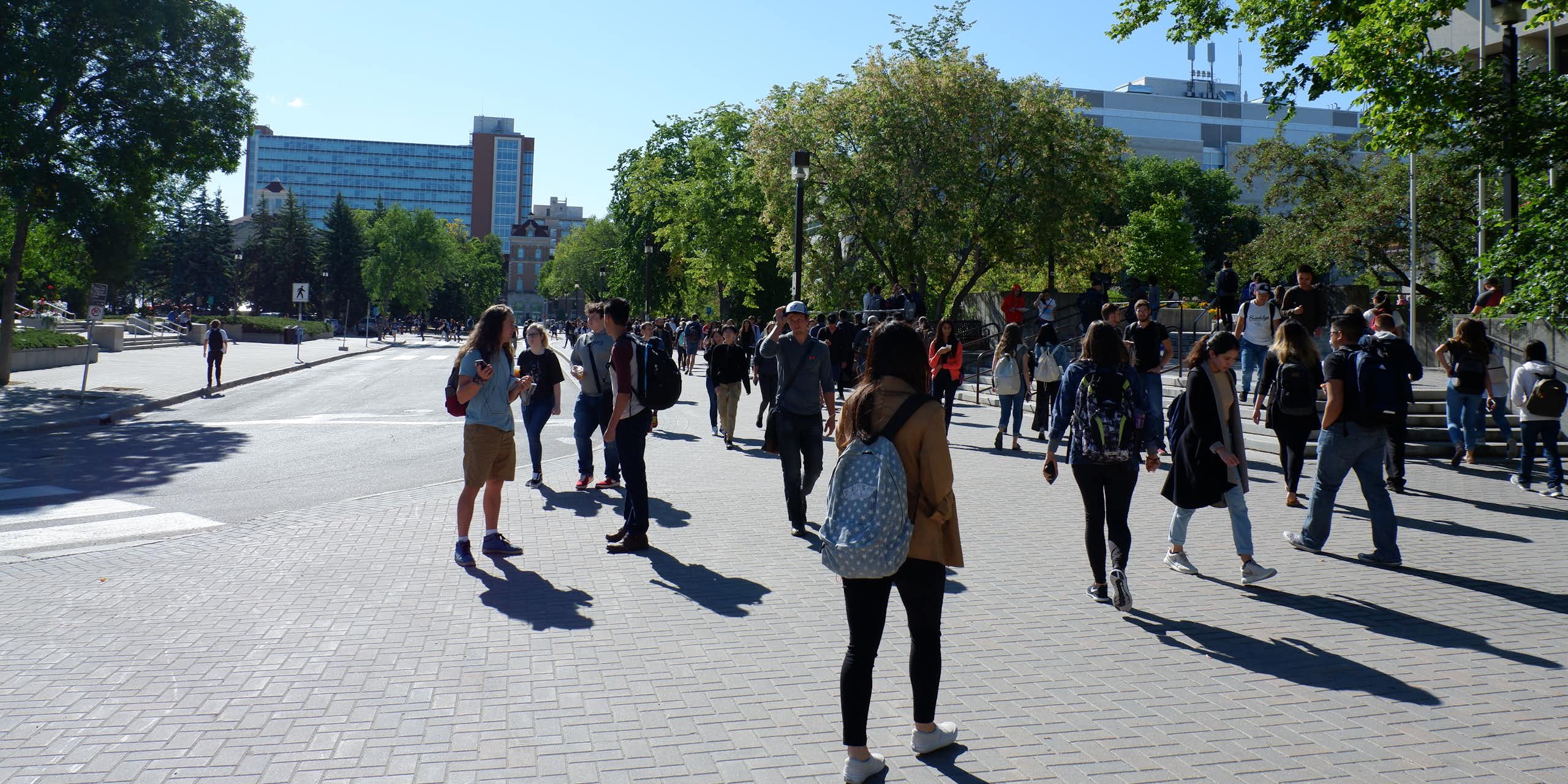 University students walking across campus.