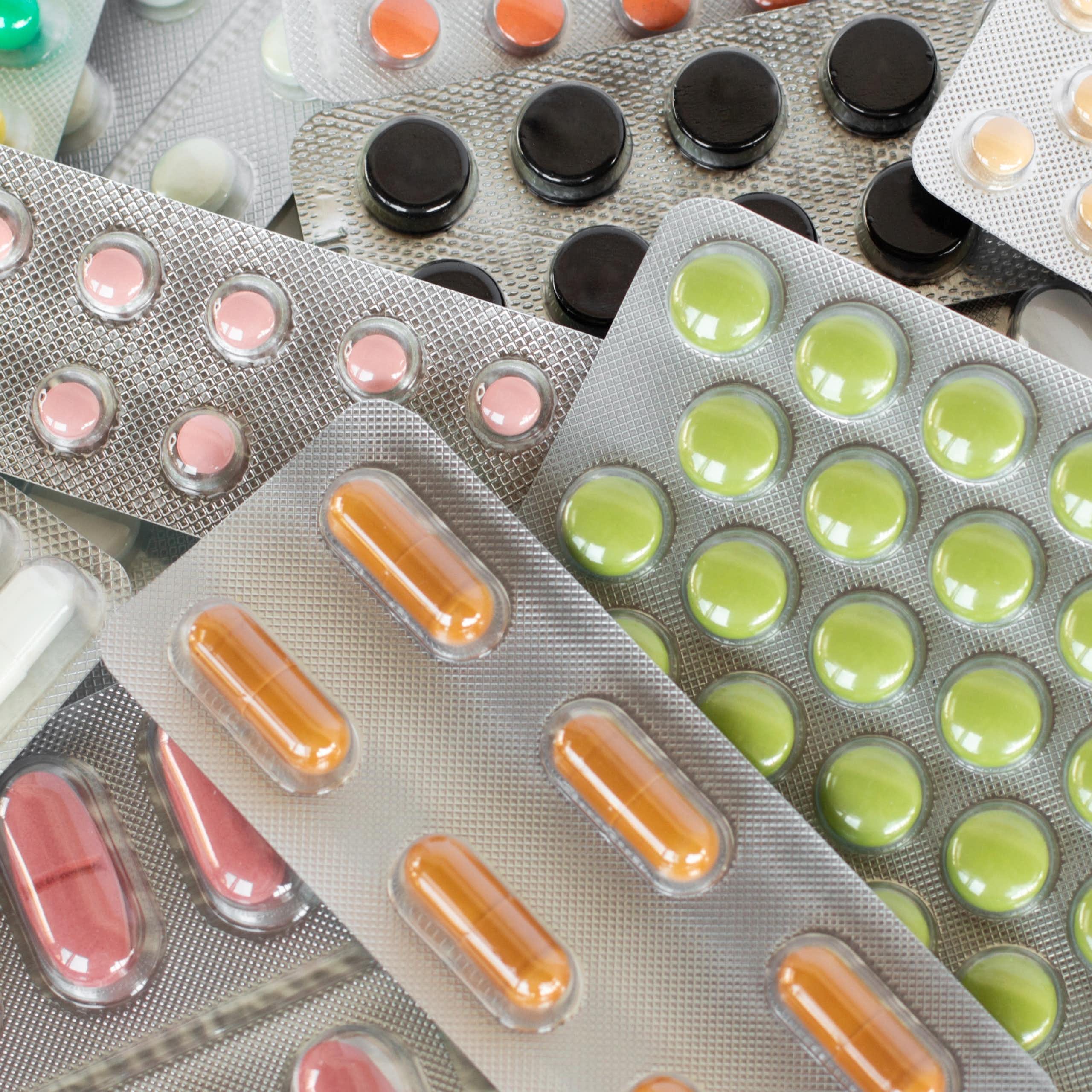A pile of pills in blister packets
