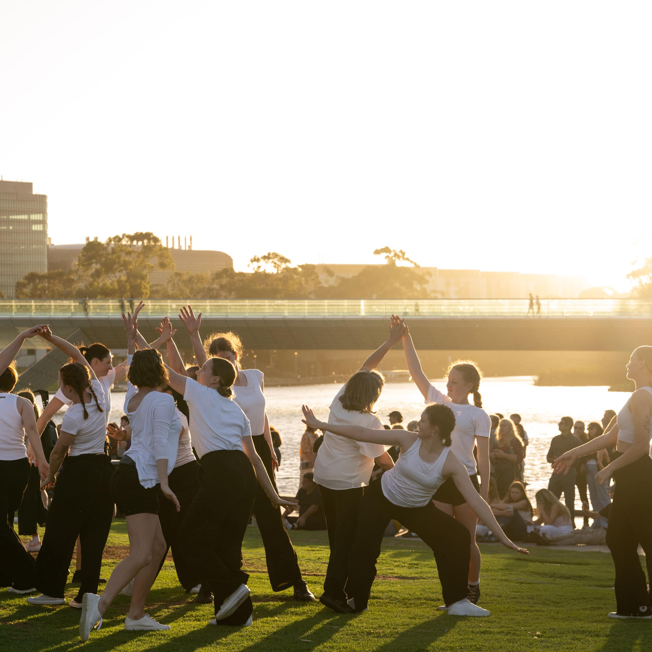 Dancers in front of a sunset.