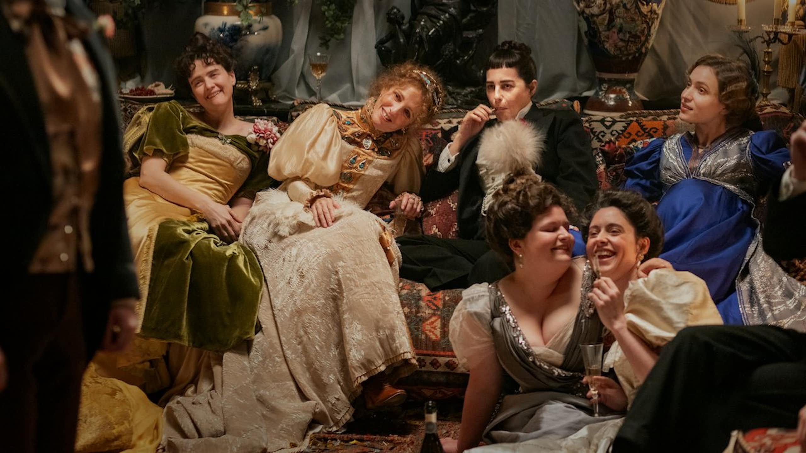 Film still: a gathering of friends at a party in 20th century France.