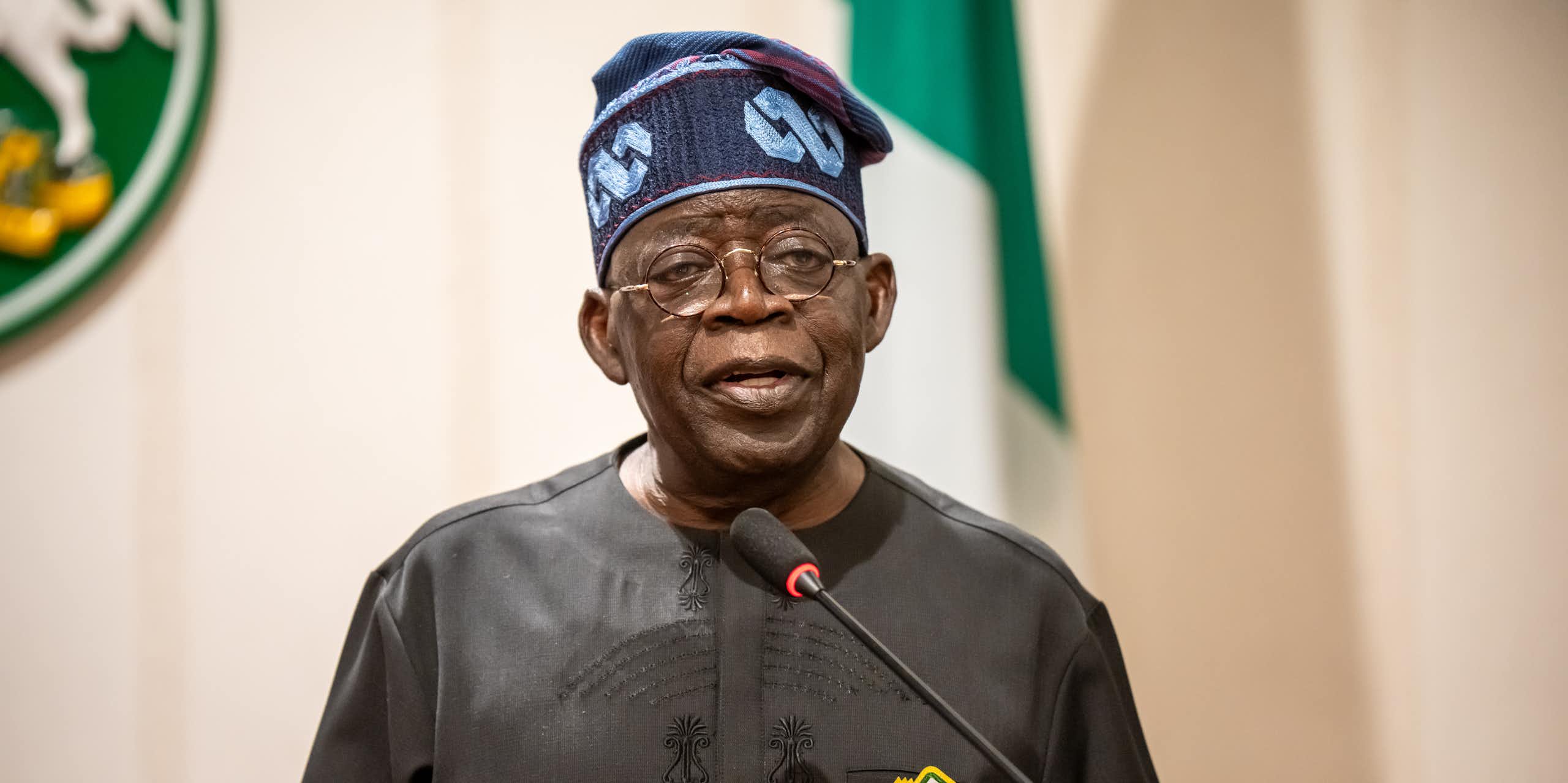 A man standing behind a microphone 