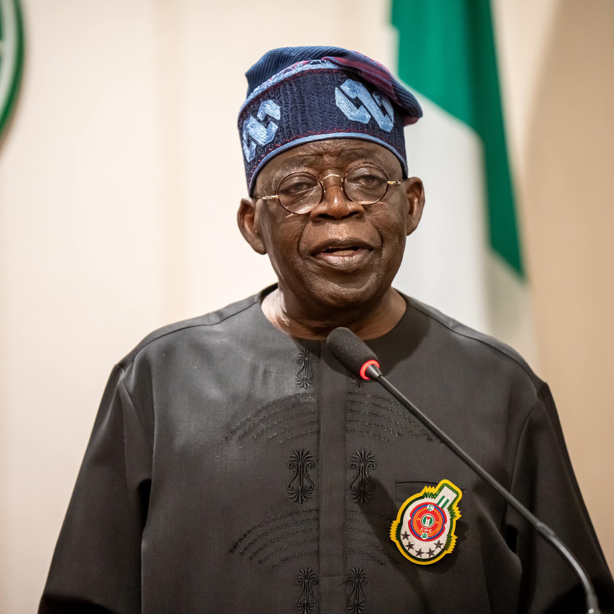 A man standing behind a microphone