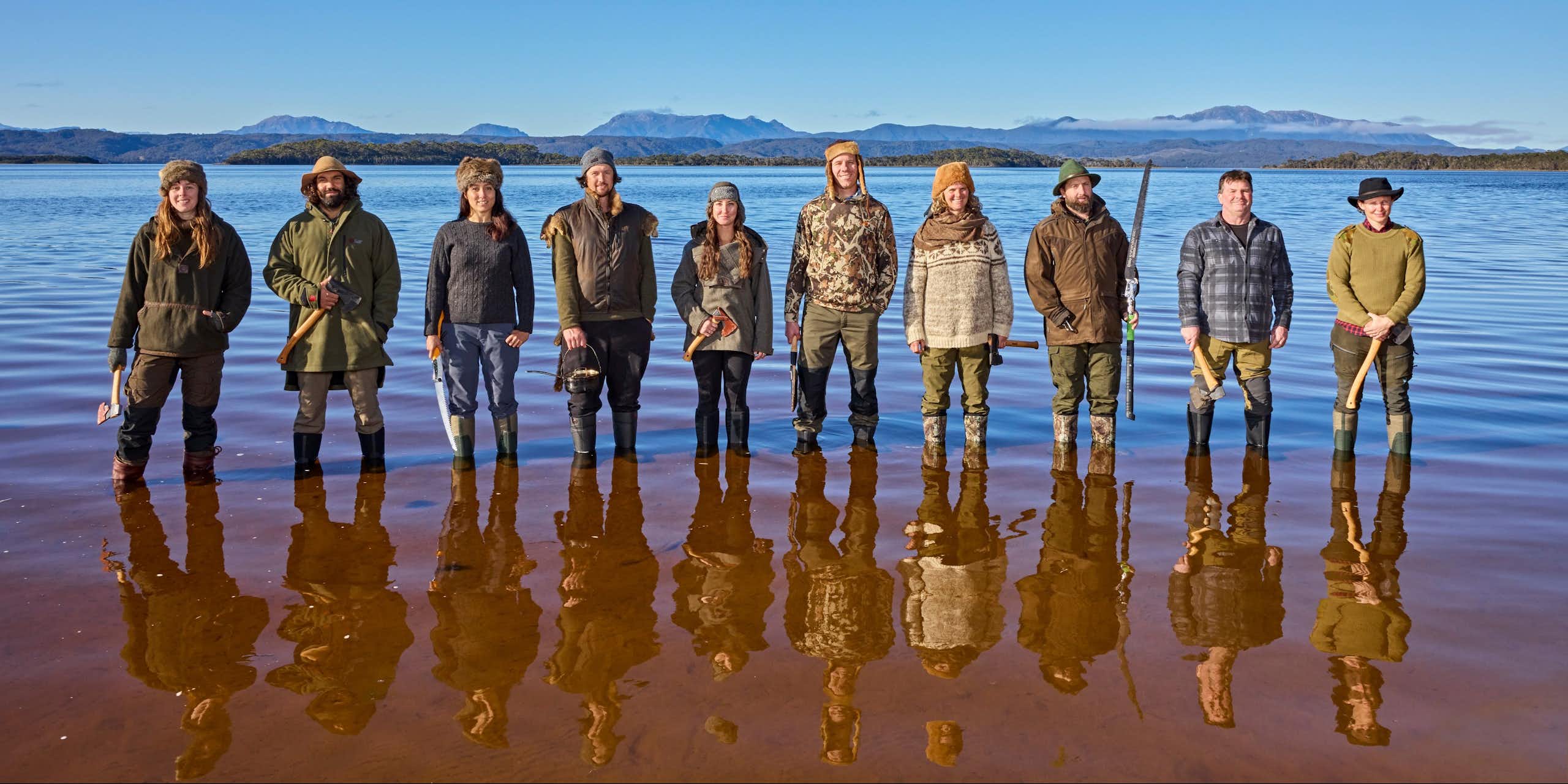 10 participants of Alone Australia 3 standing in Tasmanian waters