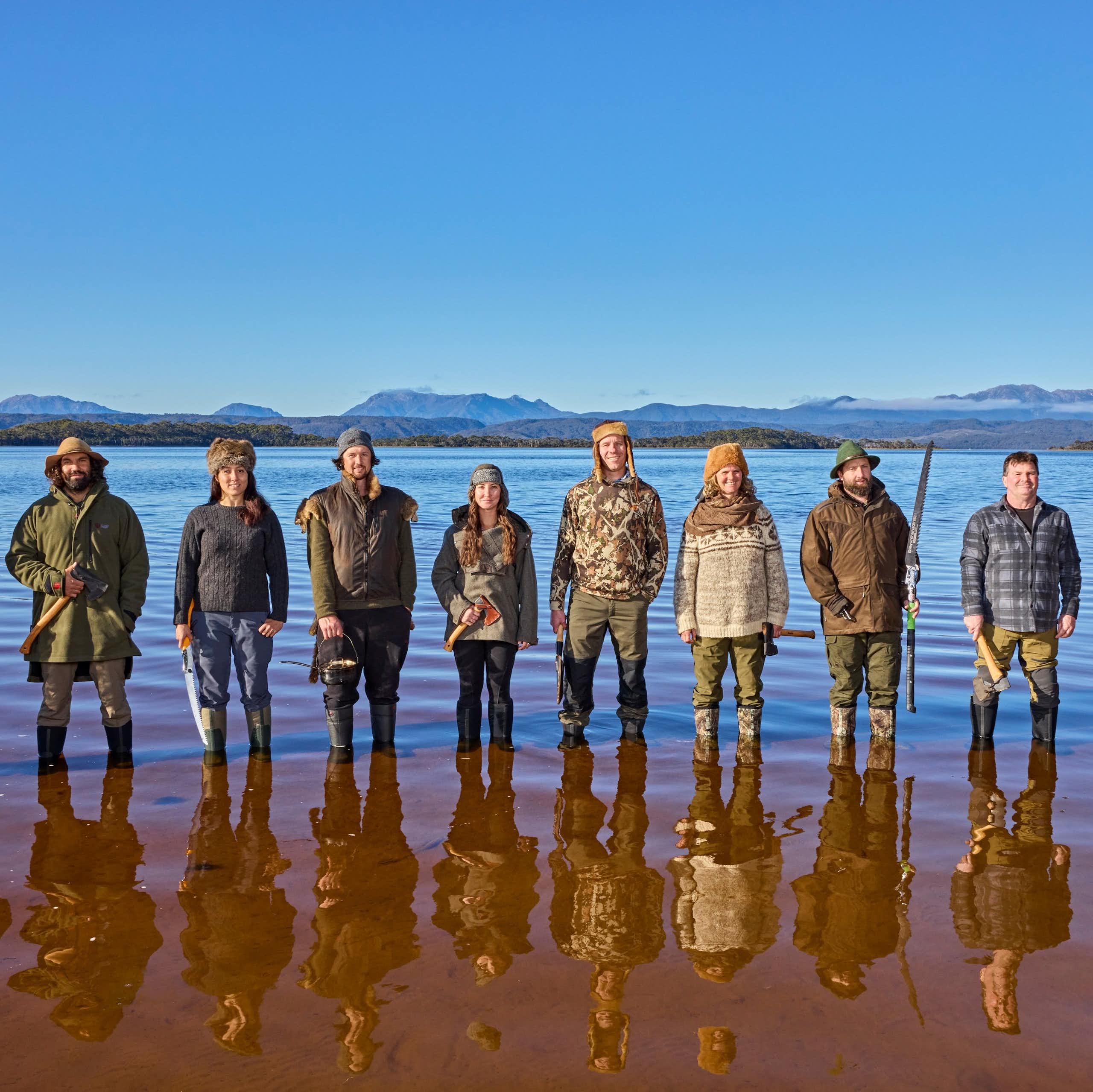 10 participants of Alone Australia 3 standing in Tasmanian waters