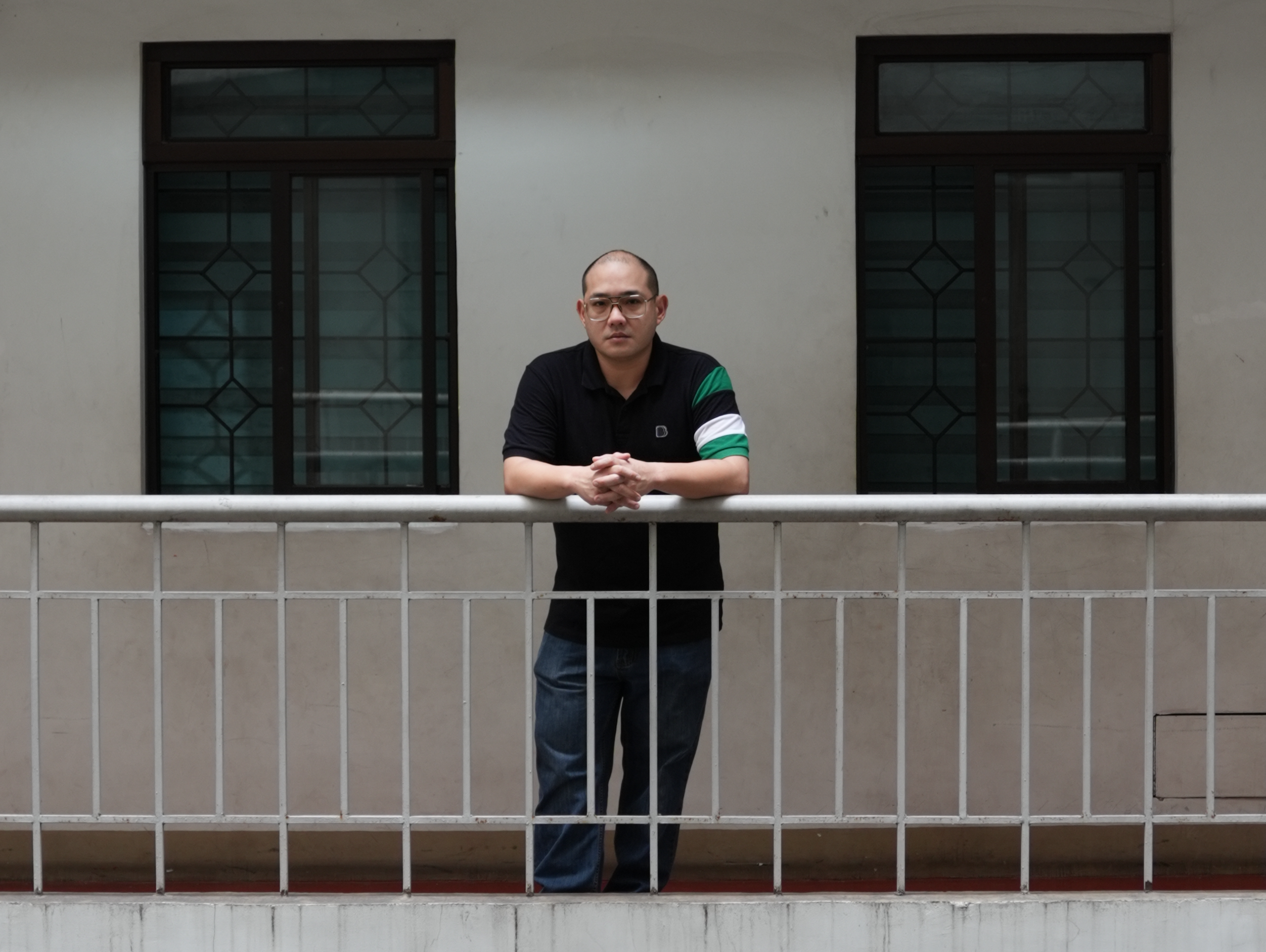 A man looking out a window